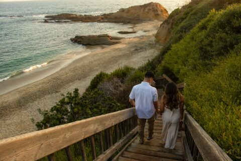 lovers holding hands on the beach