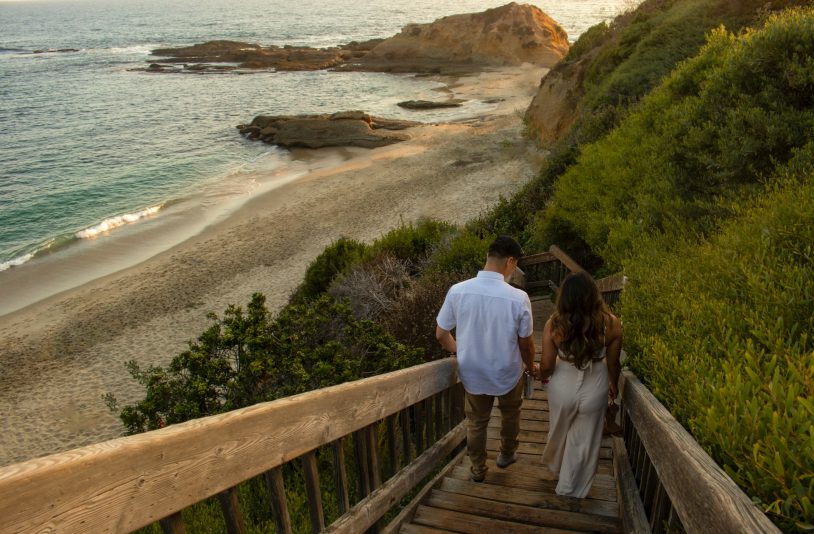lovers holding hands on the beach