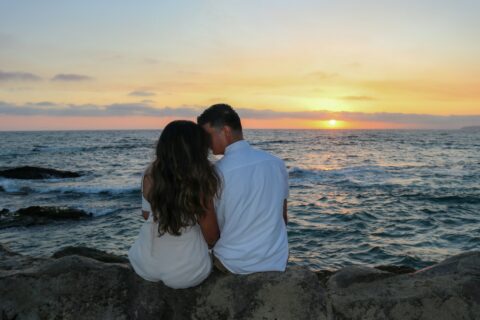 lovers kissing on the beach