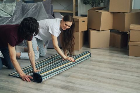 man and a woman clearing things