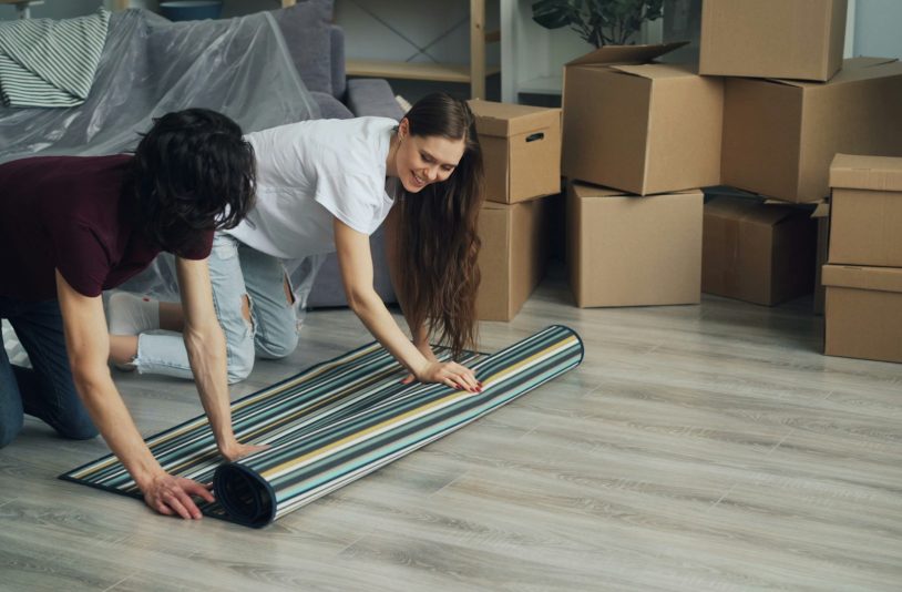 man and a woman clearing things