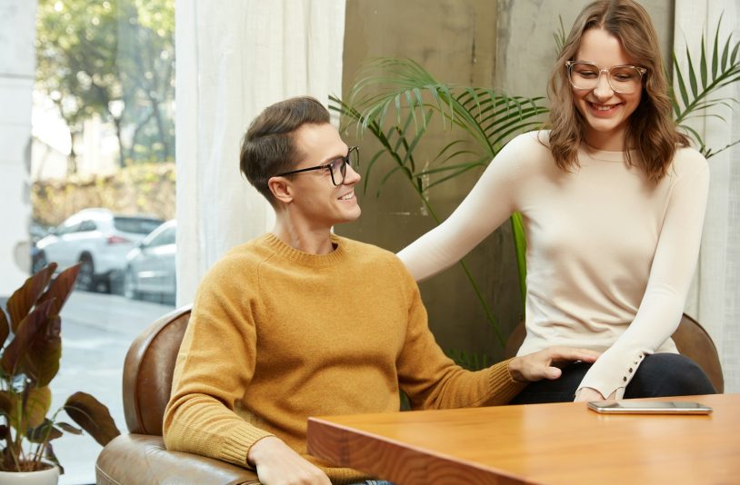 man and a woman sitting at a table