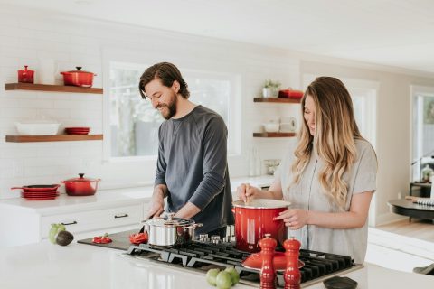 man and woman cooking