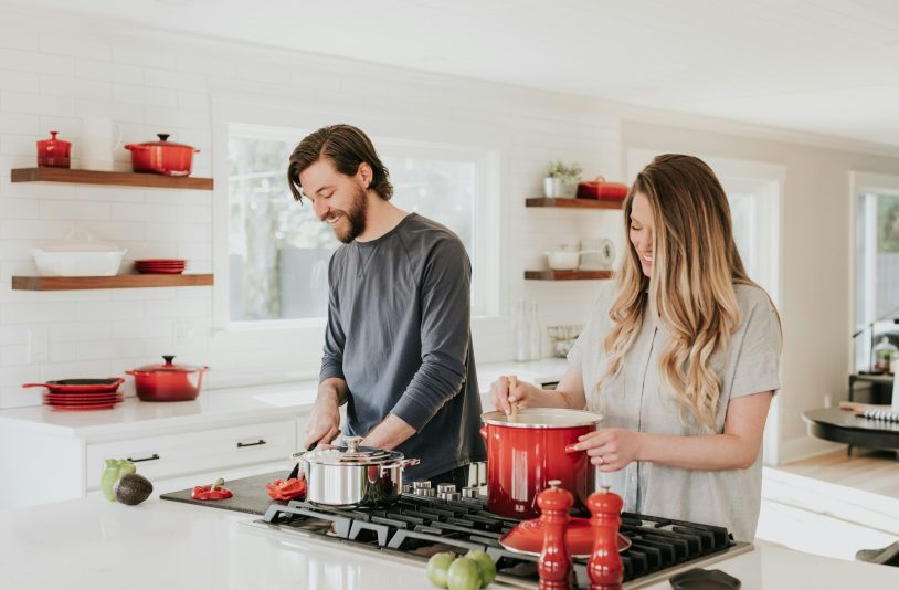man and woman cooking