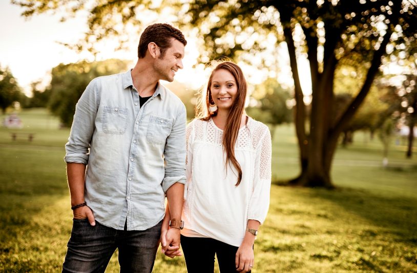 man holding hand of woman