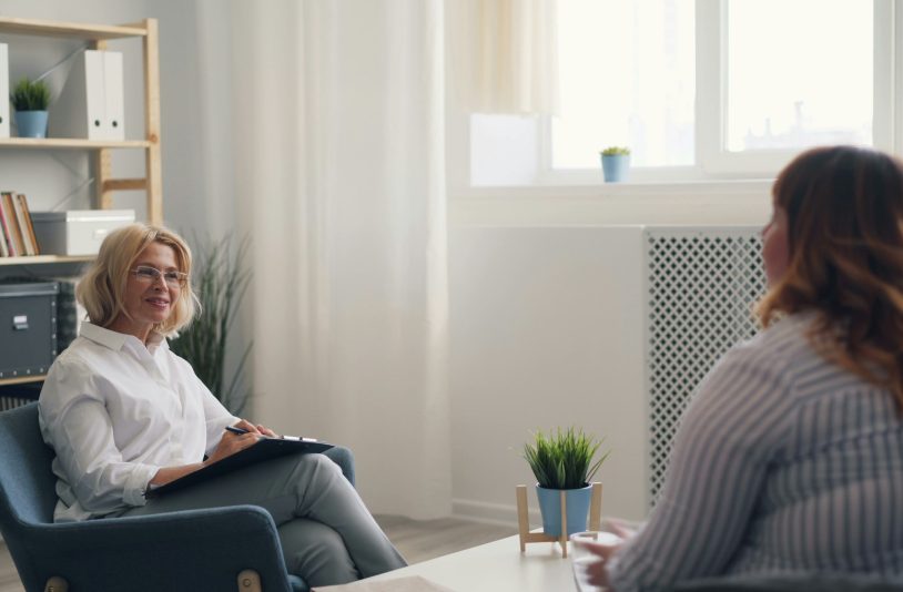 two women talking in the office