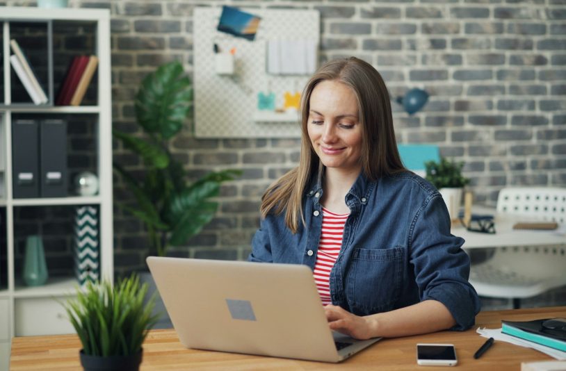 woman at a desk using a laptop