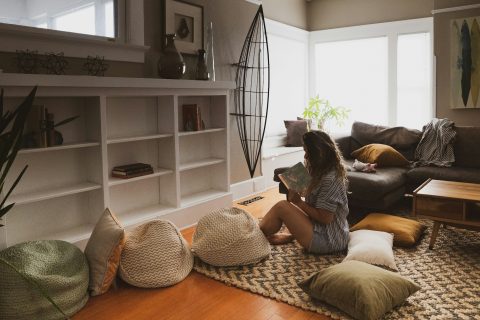 woman declutter living room
