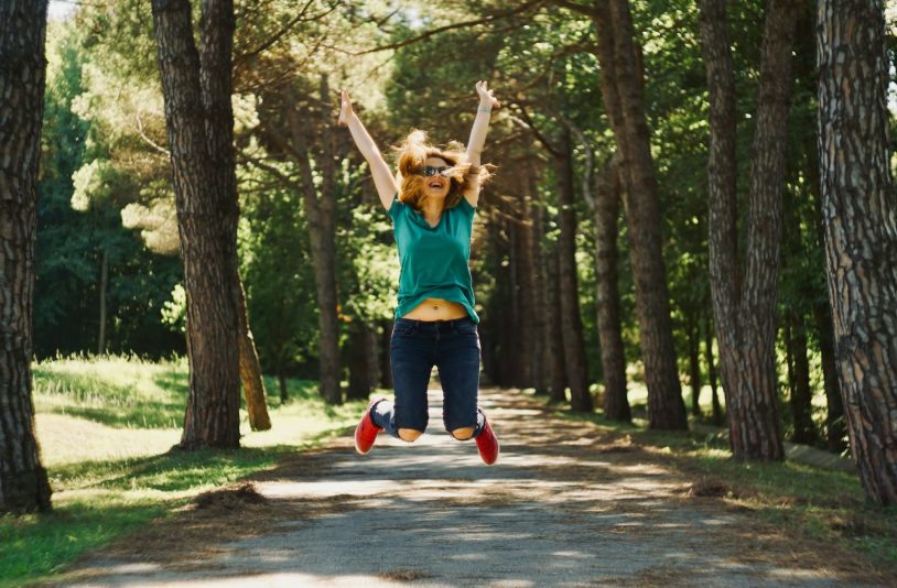 woman jumping and laughing