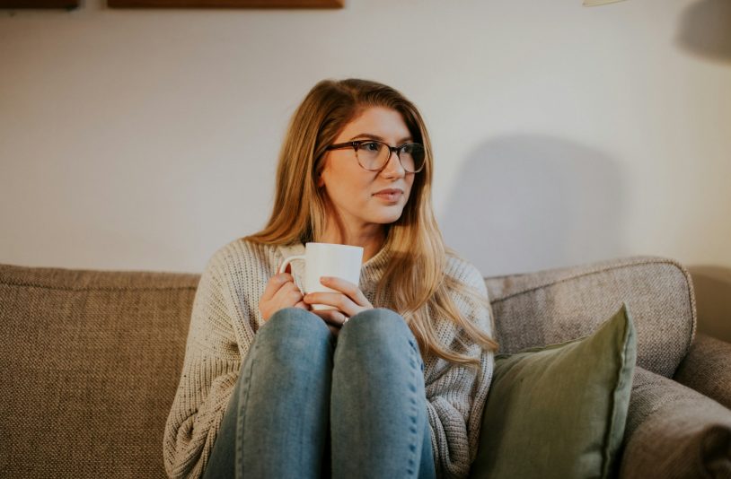 woman lonely sitting on sofa