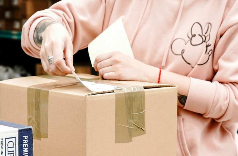 woman-packing-using-box